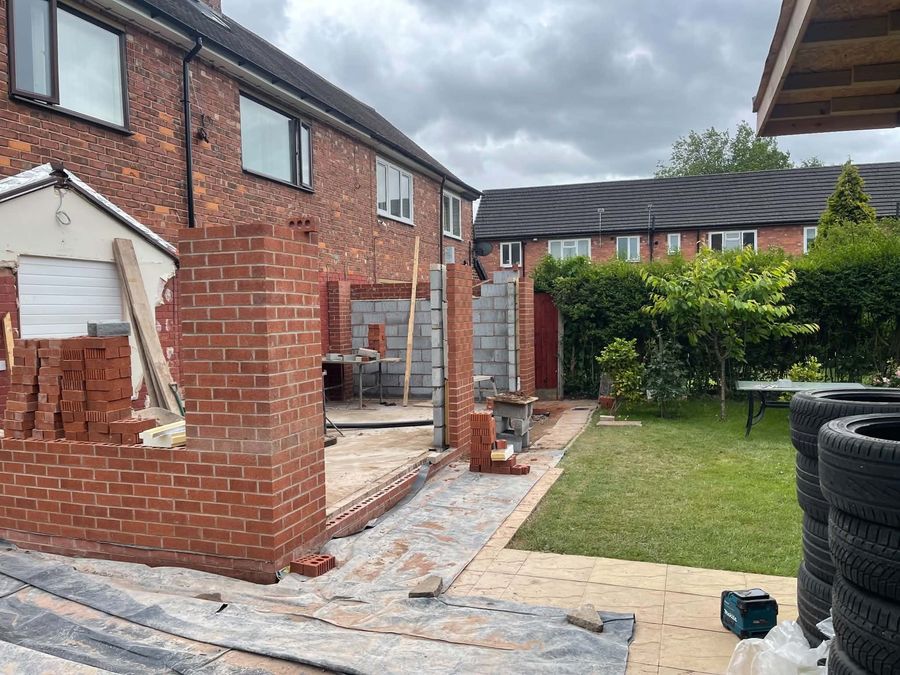 New brickwork and piers at the rear of a house with the garden reinstated