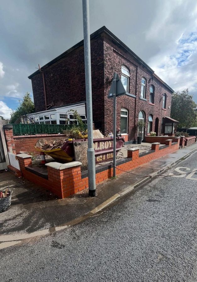 Completed red brick frontage and planters to a commercial property