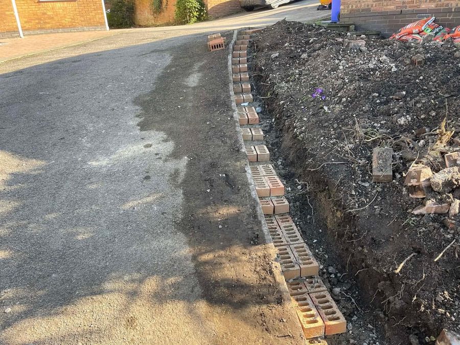 Groundwork and brick edging laid ready for a new driveway